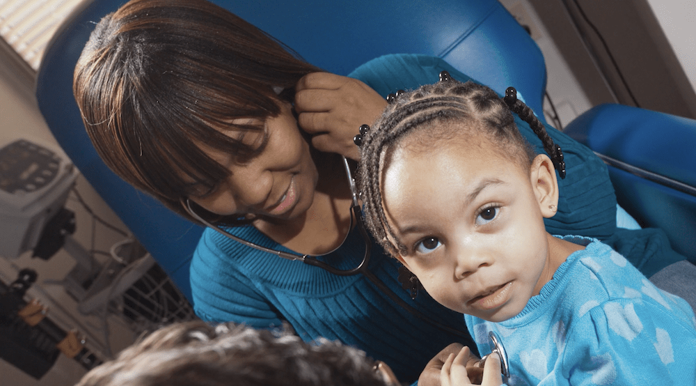 Young child and adult with stethoscope