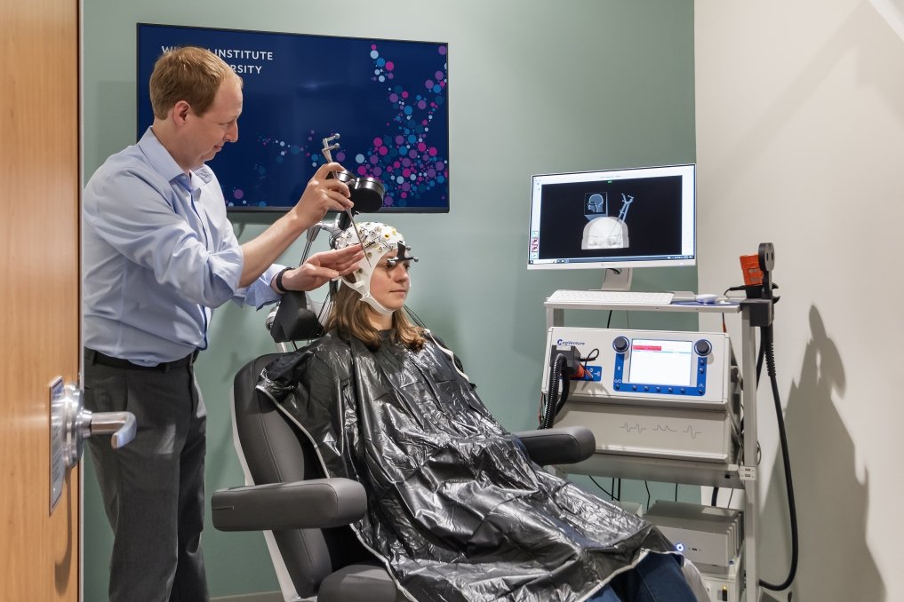 Researcher and participant in a TMS experiment. Photo by Anton Grassl, courtesy of SmithGroup