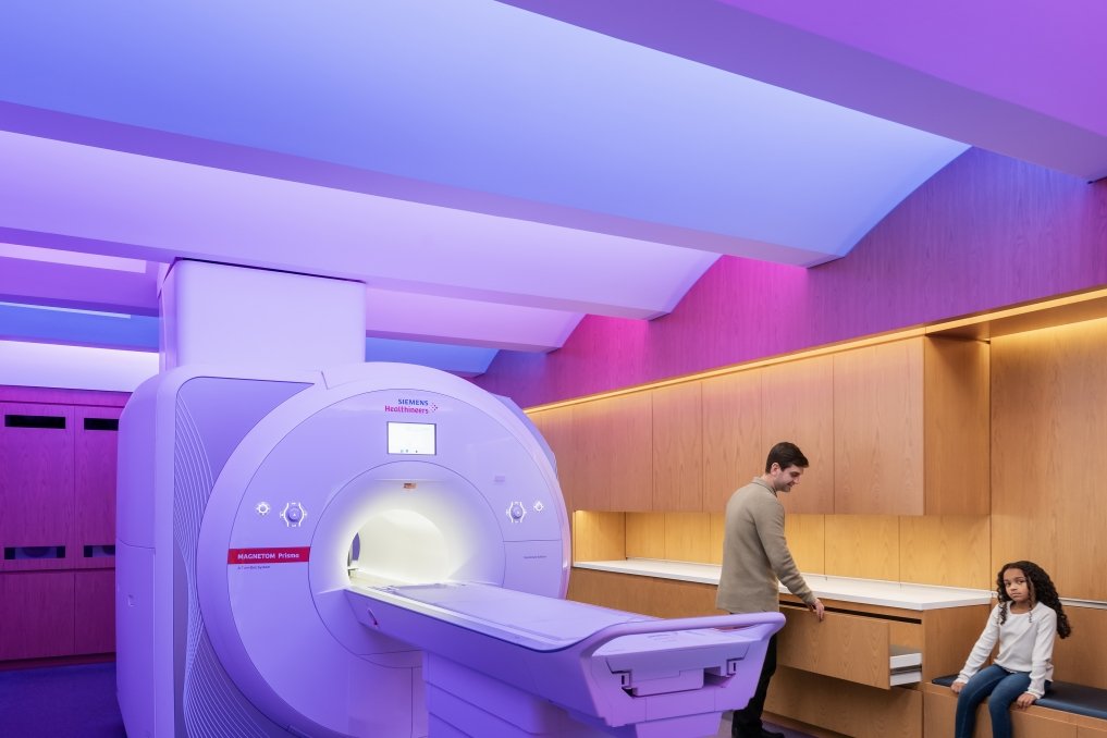 Scientist and participant inn the BrainWorks MRI. Photo by Anton Grassl, courtesy of SmithGroup