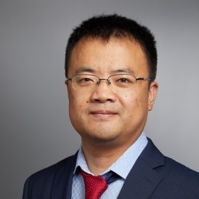 Person in glasses, jacket and tie