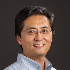 Smiling person in glasses