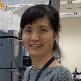 Smiling person in a lab
