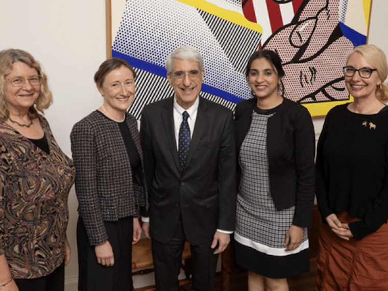 Five smiling people: Laura Abriola, Yulia Surovtseva, Nalini Dhingra, and Sheila Umlauf with President Salovey