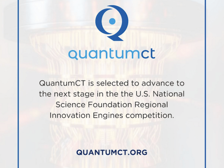 The QuantumCT logo above text about the news item & a hyperlink framed in blue, in front of a transparent photo of a quantum computer 