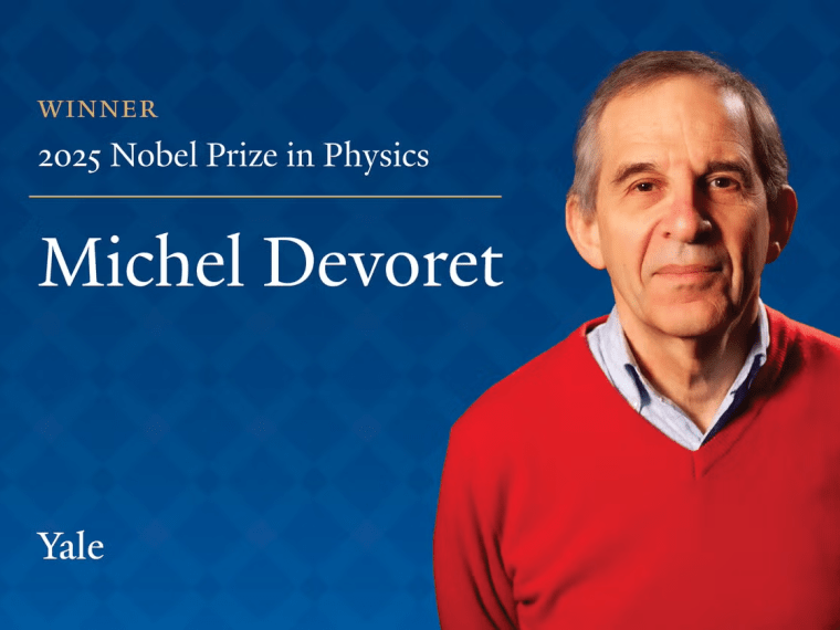 Man named Michel Devoret in red sweater against blue background