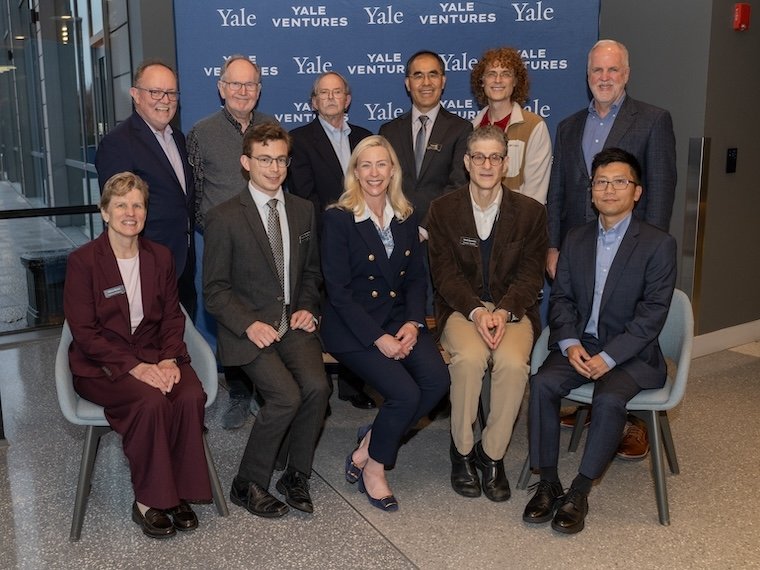 Eleven leaders pose for a group shot